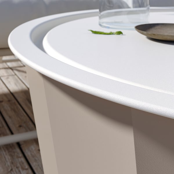 Modern white outdoor coffee table, round tray top, storage.