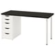 Modern desk with five drawers, black top, white base, sturdy metal legs.