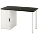 A white and black desk named LAGKAPTEN with a cabinet for storage, supported by metal legs, perfect for home offices.