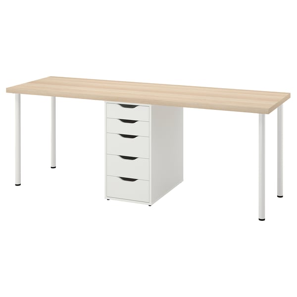 An LAGKAPTEN desk in white, with a light wood top and metal legs, including a five-drawer unit.