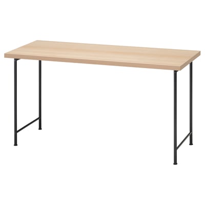 An IKEA LAGKAPTEN desk with light wooden top and black metal legs.