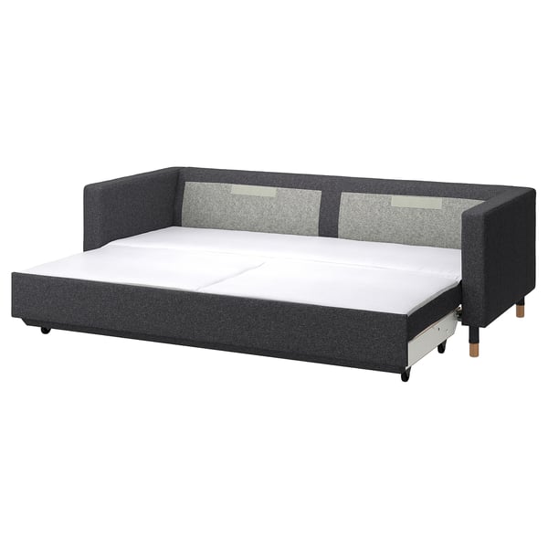 Modern sofa-bed, grey fabric, wooden legs, rectangle shape, convertible design.