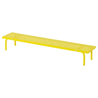 Bright yellow metal desk shelf with perforated surface, four supportive legs, rectangular shape.