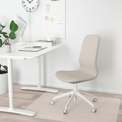 Modern home office scene with LÅNGFJÄLL chair in light beige, matching white desk, and minimalist decor.