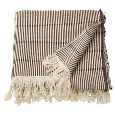 A brown/black striped blanket with fringes, made of 100% cotton, laid flat with folded edges.