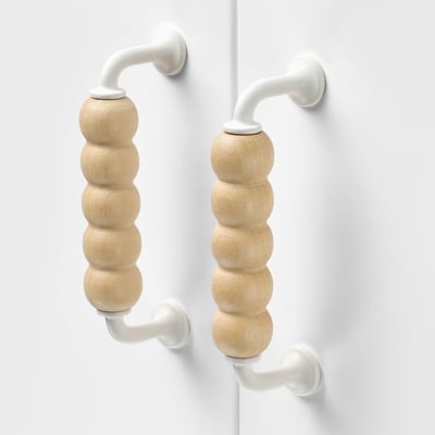 Handcrafted wooden handles, natural finish, attached to white fixtures. Elegant & simple design, showcasing quality craftsmanship.