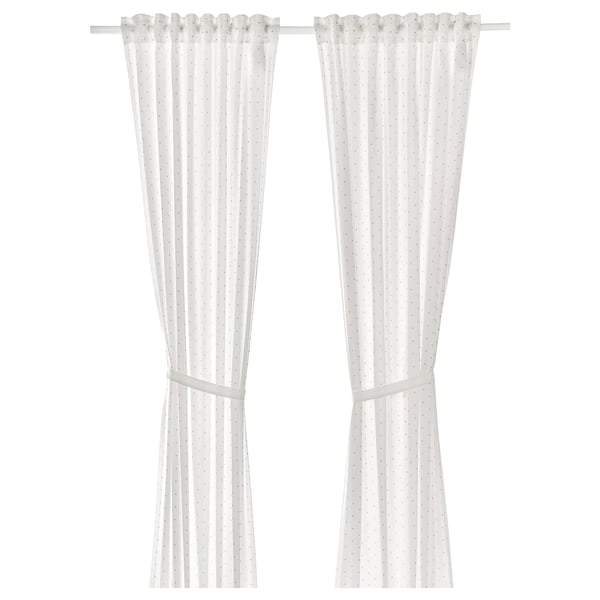 White cotton curtains with tiny dots and tiebacks.