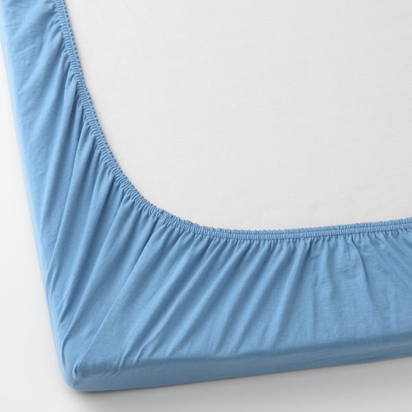 Light blue fitted bed sheet with elastic edges for secure fit. Soft, breathable cotton for comfort. Suitable for babys cot.