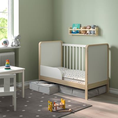 Toddler room with LENAST storage box under bed, organising toys and books neatly.