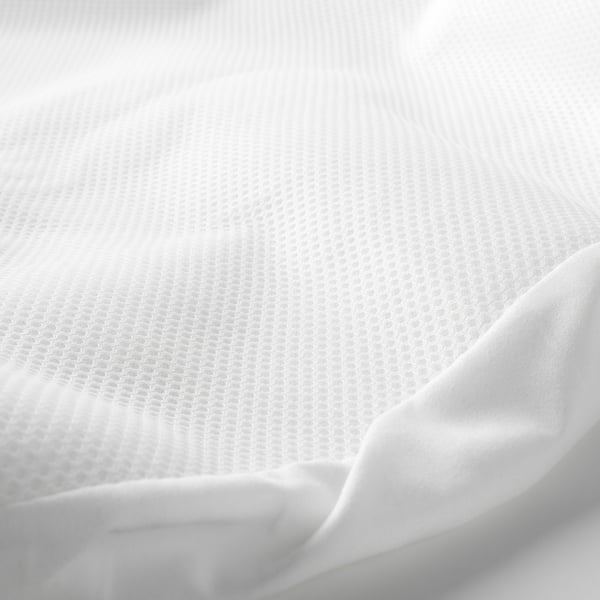 Close-up of a soft, white, textured mattress protector, showcasing its fine mesh pattern and smooth material.