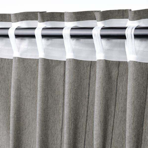 Dark grey LENDA curtains with header tape and linear weave, tied back for style.