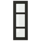 A LERHYTTAN black wooden kitchen door with bevelled edges and clear glass panels. The door has a classic, traditional design.