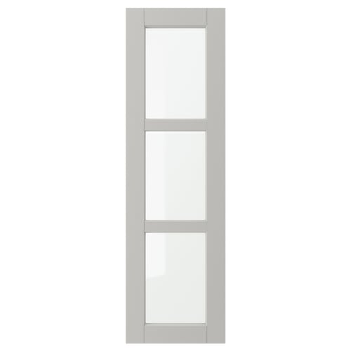A light grey LERHYTTAN kitchen cabinet door with a solid wood frame and bevelled edges featuring tempered glass panels.