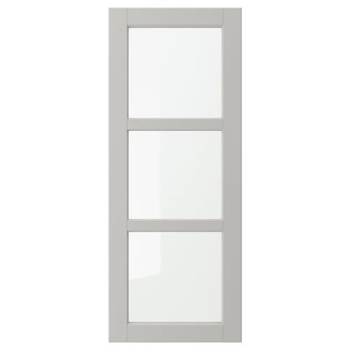 A grey LERHYTTAN cabinet door with a solid wood frame and bevelled edges, housing three clear glass panels in a rectangular layout.