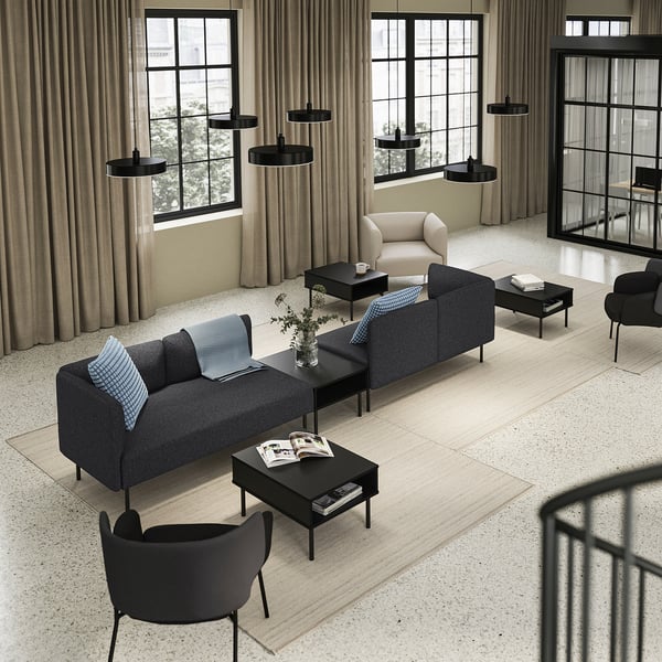Modern living room: grey LILLEHEM sofa, black coffee tables, black & beige armchairs, beige curtains, large windows, black pendant lights.