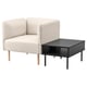 A LILLEHEM beige modular sofa with wooden legs next to a black coffee table with metal legs.