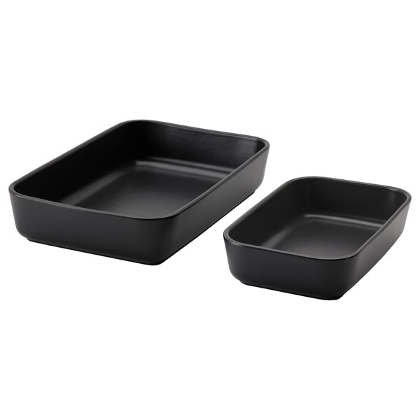 Two black, rectangular ceramic oven dishes in different sizes, suitable for baking and serving food.