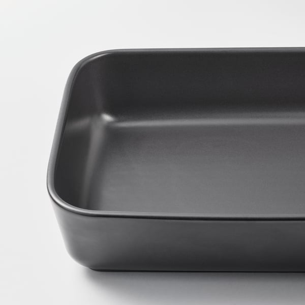 Rectangular black stoneware baking dish, smooth edges, high quality feel.