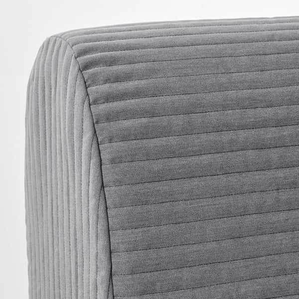 Close-up detail of a grey fabric sofa with horizontal stitching.