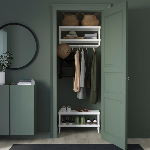 Compact entryway with MACKAPÄR white shelf, baskets, and hanging coats. Mirror and bench below.