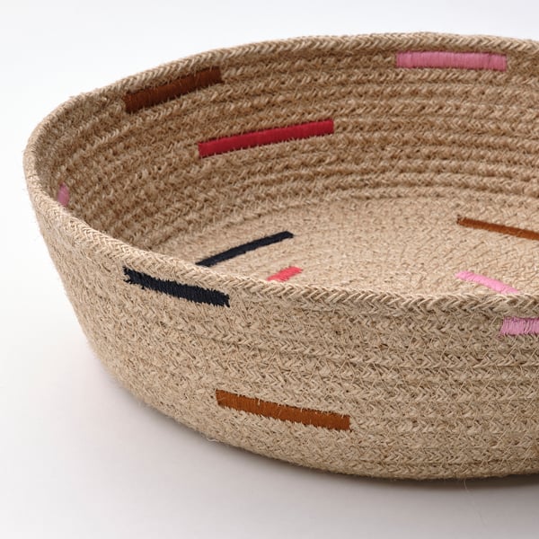 Rustic jute basket with colourful hand-embroidered designs, showcasing high-quality craftsmanship and natural texture.