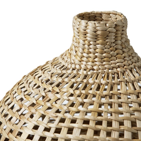 Hand-woven lamp shade with intricate, tight patterns; natural beige, woven banana fibres create textured, detailed design.
