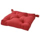 Red cushion pad with two handles, square shape, soft texture.