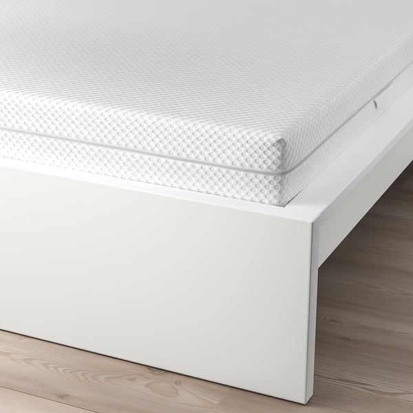 Clean, modern bed frame with adjustable sides, designed for different mattress thicknesses. High headboard for comfortable sitting.
