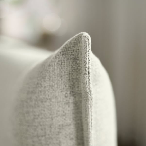 Close-up of soft, textured fabric sofa, highlighting comfort and quality.