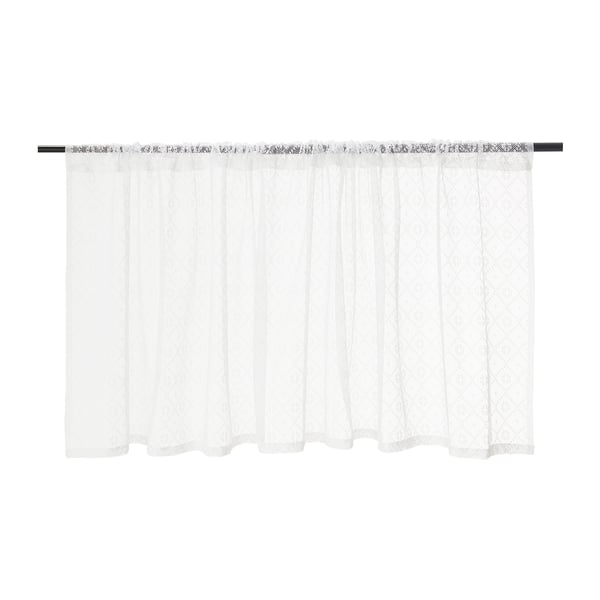 White sheer curtains with lace detail hang drawn back on a black rod, allowing light through and providing a sense of privacy.