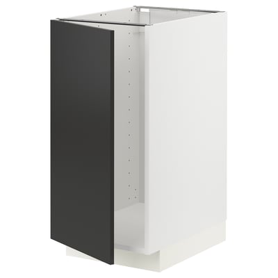 A white METOD kitchen cabinet with a matt black door. Its a modern, rectangular design.