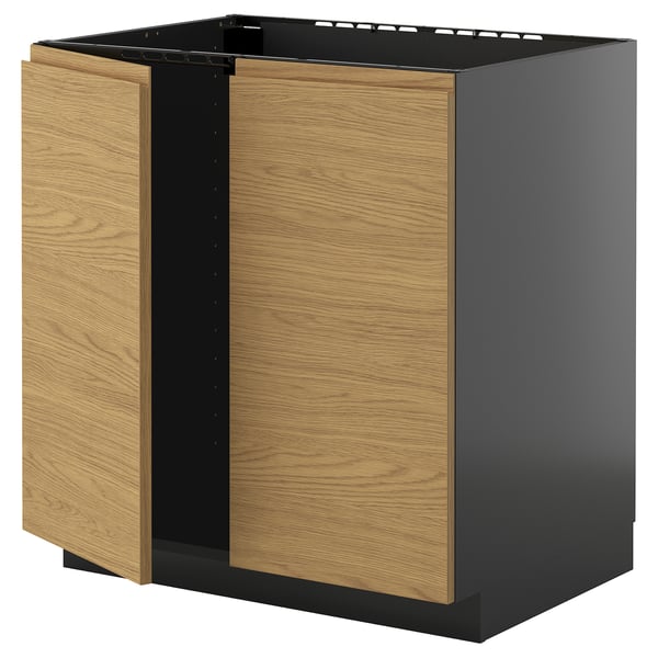 Modern kitchen cabinet with wooden door panels and black frame.