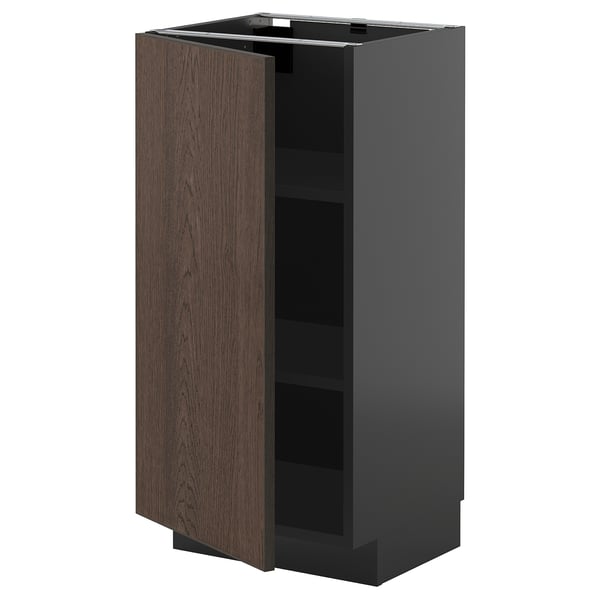 Modern METOD kitchen cabinet with dark brown doors and black frame, one door open.