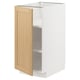 An open METOD kitchen cabinet with a light oak veneer door. It a white frame and adjustable shelves.