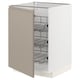 Modern beige METOD kitchen cabinet with wire baskets.