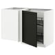 Modern white kitchen units with black stained ash doors and beveled edges, one door open revealing shelves.