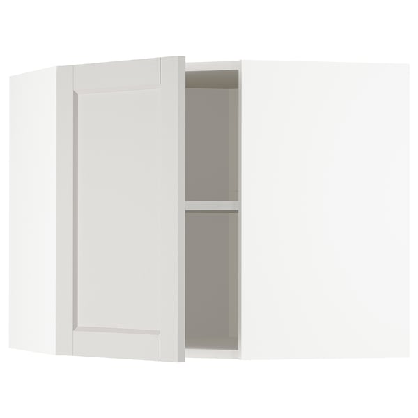 This image shows a white METOD kitchen cabinet with one door open, revealing interior shelves.