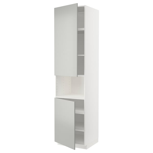 A white METOD kitchen cabinet with two open light grey doors, displaying shelves. Modern and sleek design.
