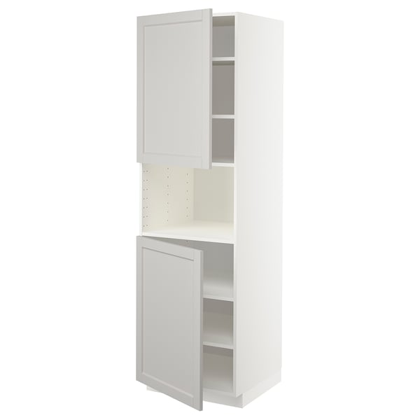 A white METOD tall kitchen cabinet with one open door, revealing adjustable shelves.