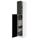 A white tall cabinet with black doors, open, revealing storage compartments. It a modern design with bevelled edges.