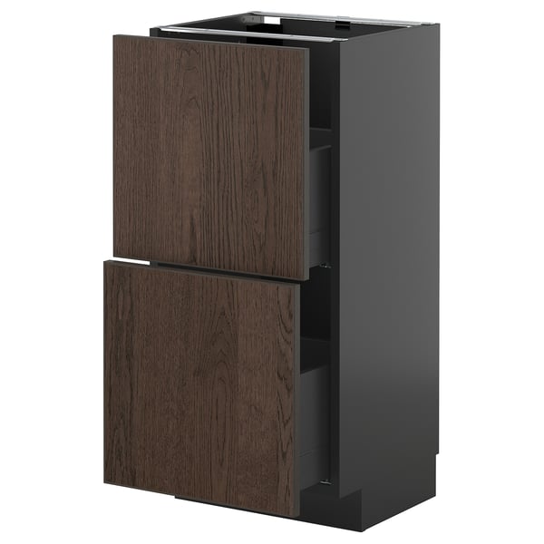 Dark brown kitchen cabinet with wooden doors and metal hinge.