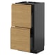 Modern kitchen unit, black base, wooden drawers, oak finish, two drawers, minimalist design.