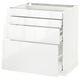 White METOD kitchen cabinet with four high-gloss drawers for storage.