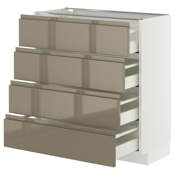 A white METOD kitchen cabinet with four dark grey-brown glossy drawers featuring integrated handles.