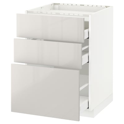 A white METOD kitchen unit with three drawers and a top shelf. The unit a modern, high-gloss finish.