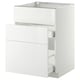White modern kitchen cabinet with glossy drawer, sleek design, part of METOD system.
