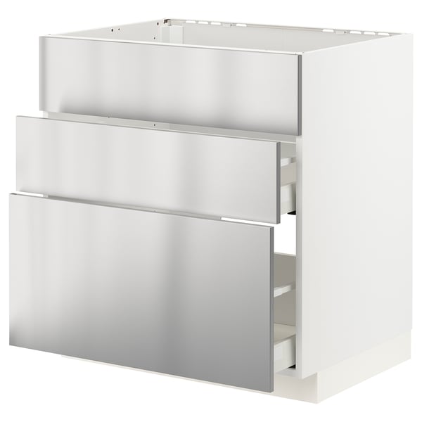 A white METOD kitchen unit with three stainless-steel drawers.