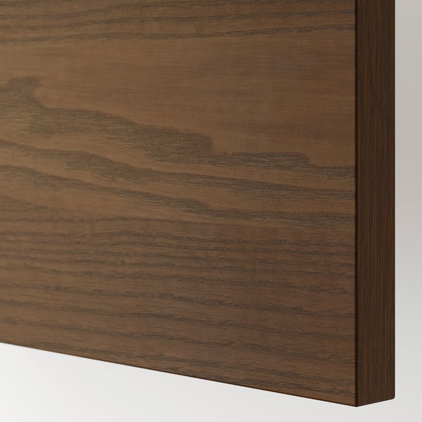 Close-up of rich, dark brown wooden drawer front, showcasing smooth grain and polished finish.