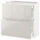 METOD high gloss white kitchen cabinet with open drawers.