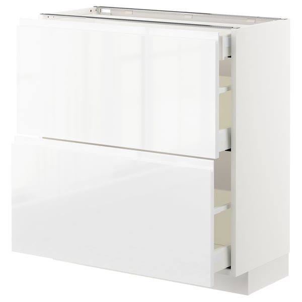 Modern white METOD kitchen cabinet with sleek, handle-less design and pull-out drawers.